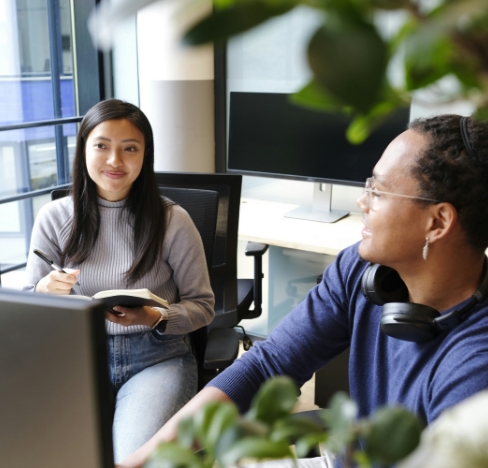 two people working in an office.
