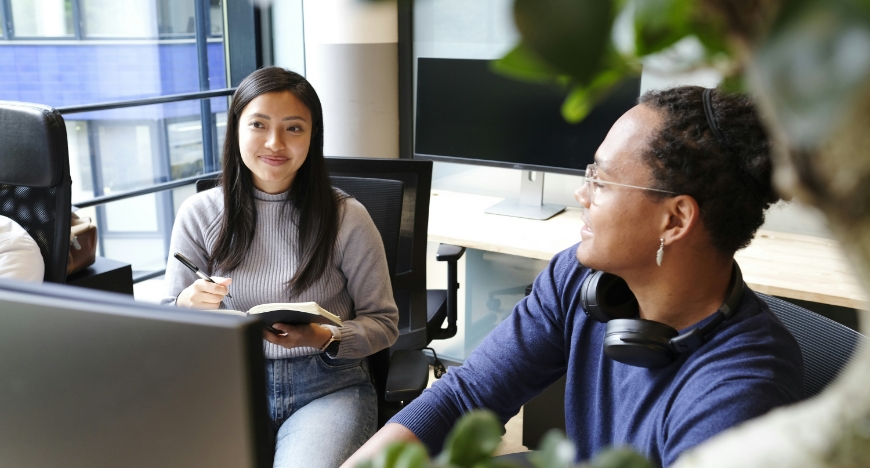 two people working in an office.
